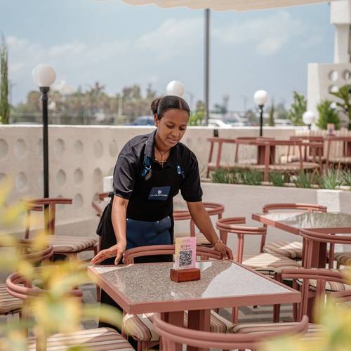 Summit staff setting a table